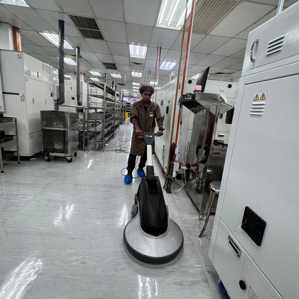 Technicians in clean room attire.